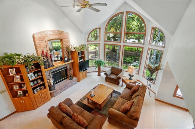 6011 W Wallen Rd, Fort Wayne, IN 46818 - living area featuring ceiling fan, a brick fireplace, healthy amount of natural light, baseboards, and high vaulted ceiling