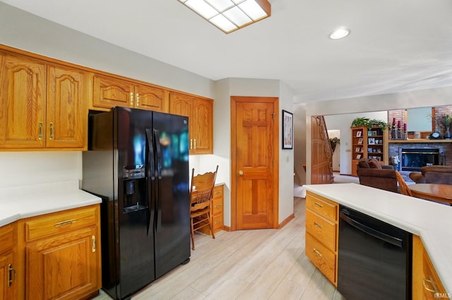 6011 W Wallen Rd, Fort Wayne, IN 46818 - kitchen featuring black appliances, light countertops, brown cabinets, open floor plan, and recessed lighting