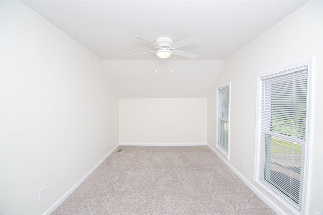 9031 Mill St, Stockwell, IN 47983 - additional living space featuring light colored carpet, vaulted ceiling, baseboards, and a ceiling fan