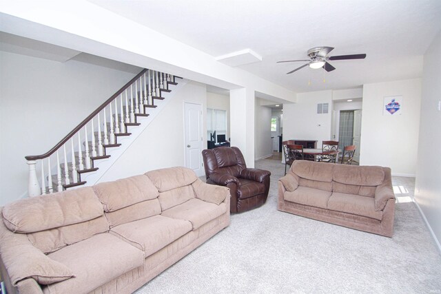 9031 Mill St, Stockwell, IN 47983 - living area featuring carpet floors, a ceiling fan, stairway, and baseboards