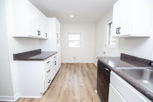 9031 Mill St, Stockwell, IN 47983 - kitchen with black dishwasher, light wood-style floors, white cabinetry, a sink, and recessed lighting