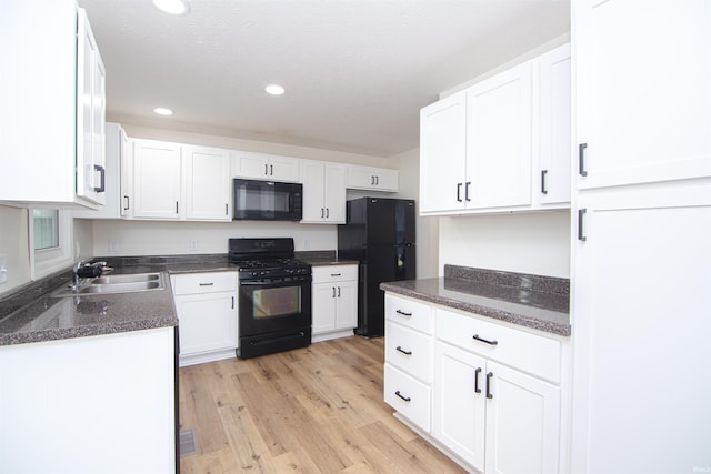 9031 Mill St, Stockwell, IN 47983 - kitchen featuring black appliances, a sink, white cabinets, and recessed lighting