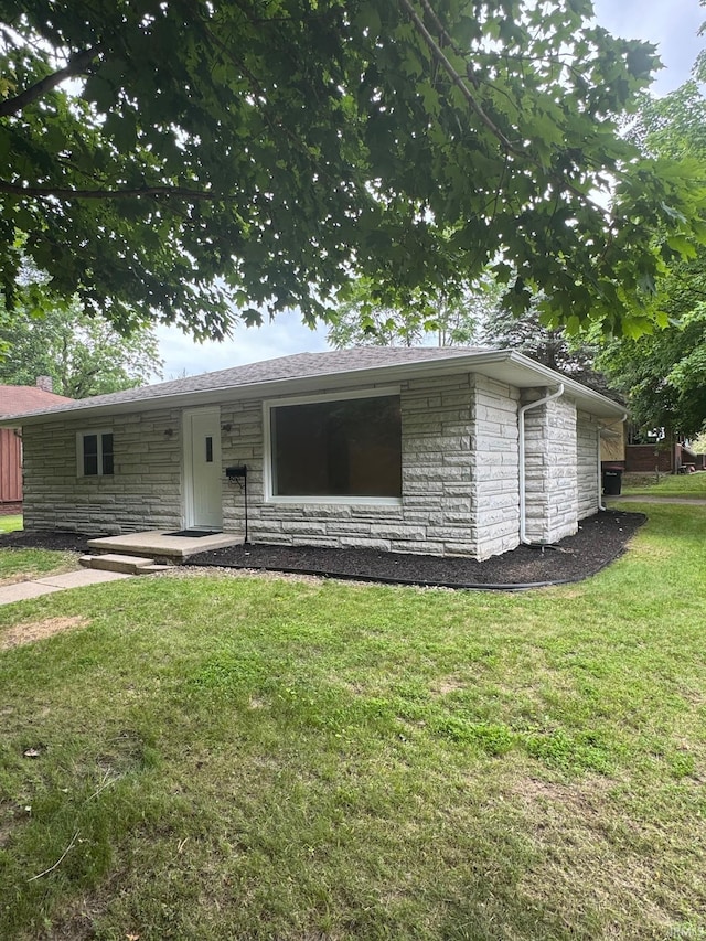 701 Ravine Park Blvd, Attica, IN 47918 - view of front of home featuring stone siding and a front yard