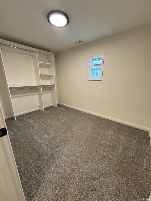 701 Ravine Park Blvd, Attica, IN 47918 - spare room with dark carpet and baseboards