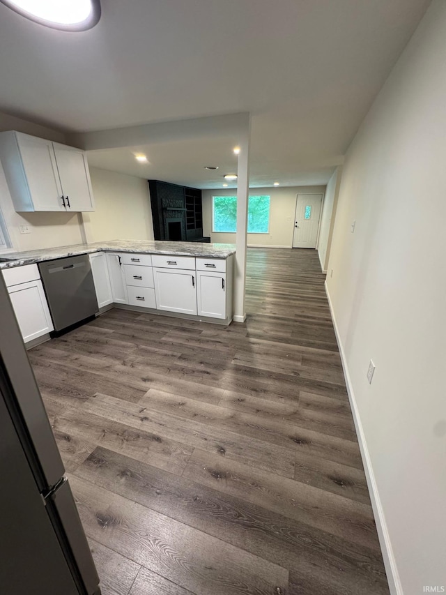701 Ravine Park Blvd, Attica, IN 47918 - kitchen featuring dishwasher, dark wood-type flooring, white cabinetry, baseboards, and light countertops