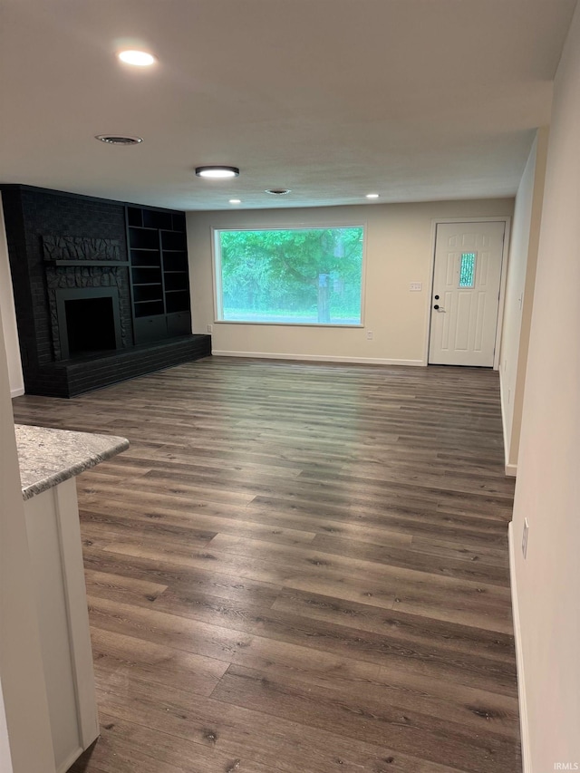 701 Ravine Park Blvd, Attica, IN 47918 - unfurnished living room featuring wood finished floors, recessed lighting, a fireplace, and baseboards