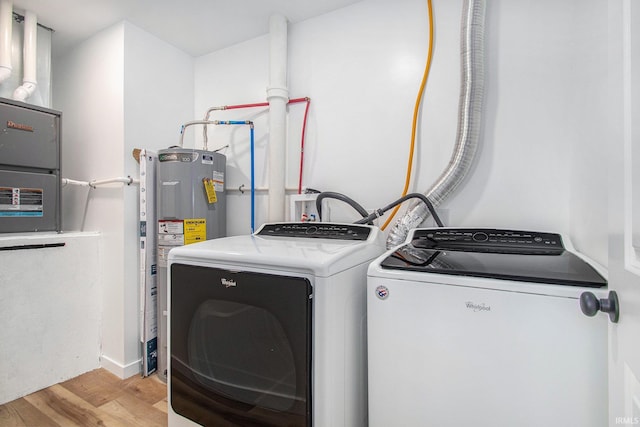 200 Johnson St, Elkhart, IN 46516 - washroom with washer and dryer, water heater, and light wood-type flooring