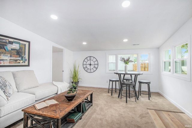 200 Johnson St, Elkhart, IN 46516 - living area with plenty of natural light, recessed lighting, light colored carpet, and baseboards
