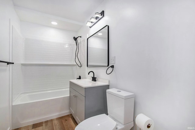 200 Johnson St, Elkhart, IN 46516 - bathroom with toilet, vanity, shower / tub combination, wood finished floors, and recessed lighting