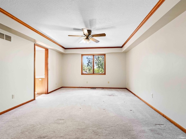 509 Water Meade Pl, Fort Wayne, IN 46825 - carpeted empty room featuring ornamental molding, ceiling fan, baseboards, and a textured ceiling
