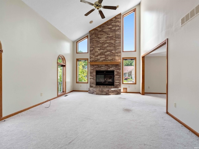 509 Water Meade Pl, Fort Wayne, IN 46825 - unfurnished living room featuring high vaulted ceiling, a ceiling fan, carpet flooring, a fireplace, and baseboards