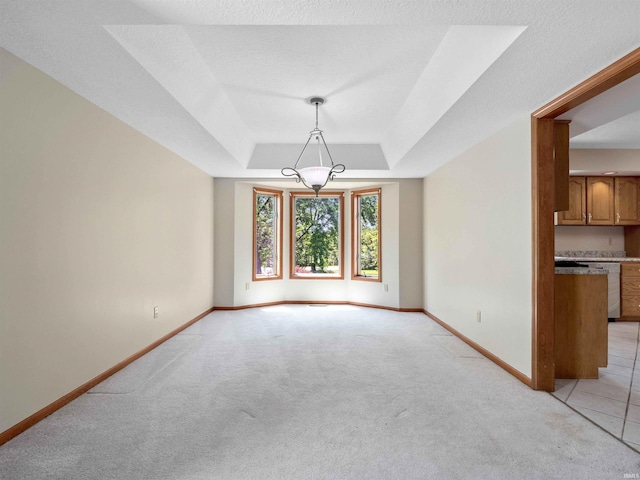 509 Water Meade Pl, Fort Wayne, IN 46825 - empty room featuring light colored carpet, baseboards, and a raised ceiling