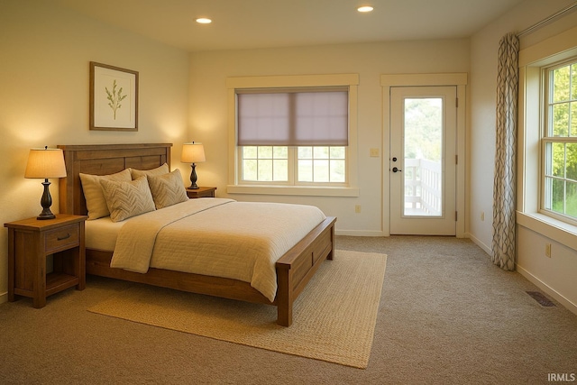 7458 E Lincolnway Rd, Columbia City, IN 46725 - bedroom featuring access to outside, light colored carpet, recessed lighting, and baseboards