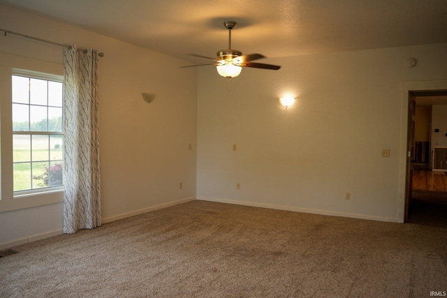 7458 E Lincolnway Rd, Columbia City, IN 46725 - carpeted empty room with ceiling fan and baseboards