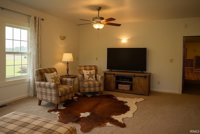 7458 E Lincolnway Rd, Columbia City, IN 46725 - carpeted living room featuring a ceiling fan and baseboards