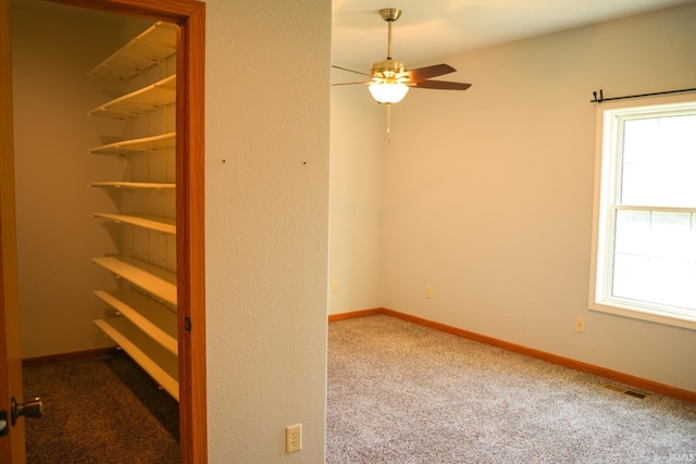 7458 E Lincolnway Rd, Columbia City, IN 46725 - spare room with ceiling fan, carpet, and baseboards