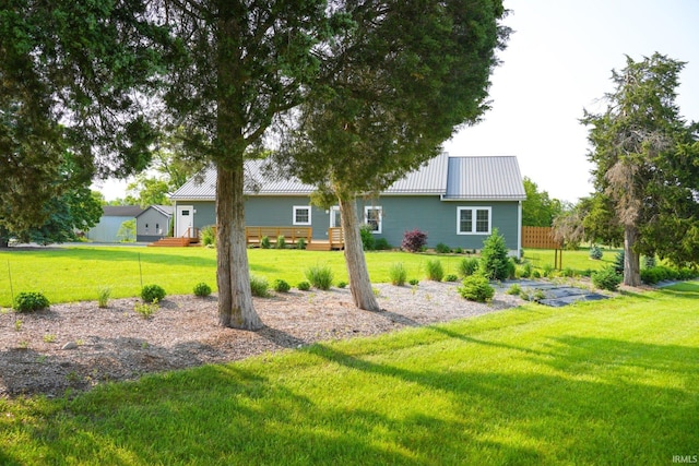 7458 E Lincolnway Rd, Columbia City, IN 46725 - back of property with a yard and metal roof