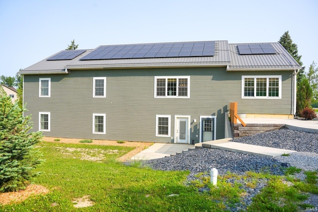 7458 E Lincolnway Rd, Columbia City, IN 46725 - back of house featuring solar panels, a standing seam roof, and metal roof