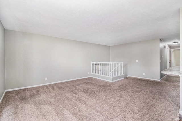 1708 Canterbury Dr, Elkhart, IN 46514 - carpeted empty room with baseboards and a textured ceiling