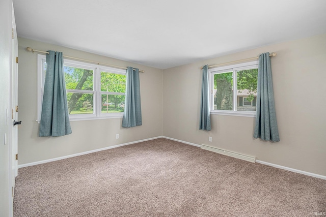1708 Canterbury Dr, Elkhart, IN 46514 - empty room featuring plenty of natural light, a baseboard radiator, carpet flooring, and baseboards