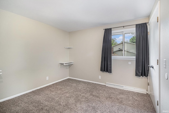 1708 Canterbury Dr, Elkhart, IN 46514 - unfurnished room featuring carpet floors, baseboards, and a baseboard heating unit