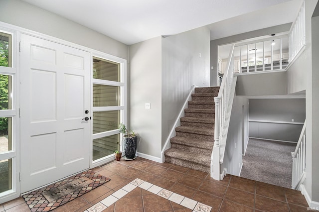 1708 Canterbury Dr, Elkhart, IN 46514 - entryway with tile patterned flooring, stairs, and baseboards
