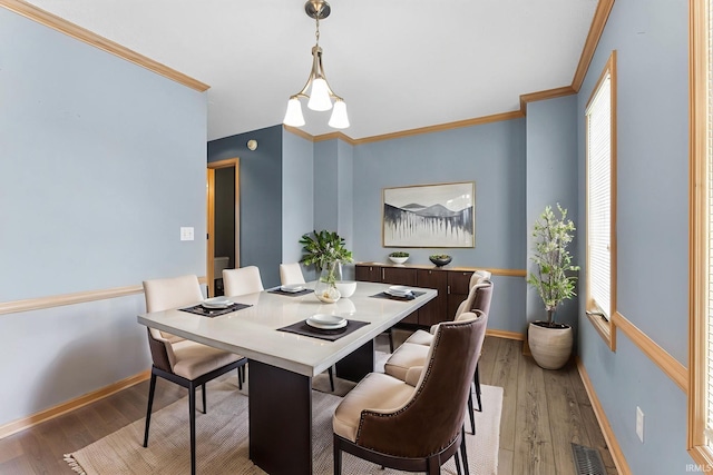 9529 Skipjack Cv, Fort Wayne, IN 46835 - dining space featuring light wood finished floors, ornamental molding, and baseboards