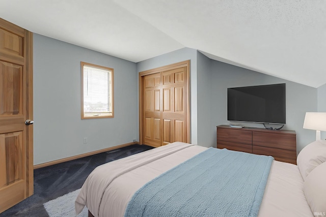 9529 Skipjack Cv, Fort Wayne, IN 46835 - carpeted bedroom featuring vaulted ceiling, a closet, and baseboards