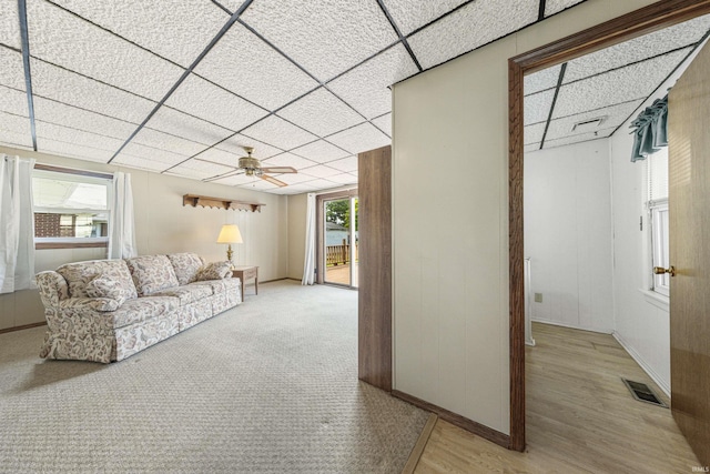 1209 E Water St, Mount Vernon, IN 47620 - living room with a ceiling fan, light wood-type flooring, baseboards, and a paneled ceiling