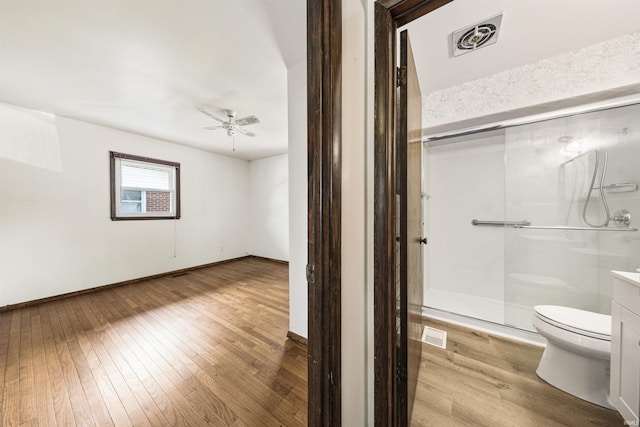 1209 E Water St, Mount Vernon, IN 47620 - bathroom with toilet, a shower stall, hardwood / wood-style flooring, and a ceiling fan