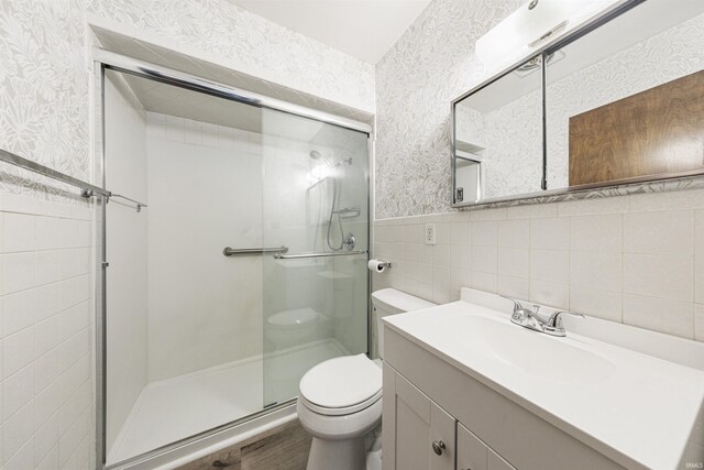 1209 E Water St, Mount Vernon, IN 47620 - bathroom featuring wallpapered walls, toilet, a shower stall, vanity, and wainscoting