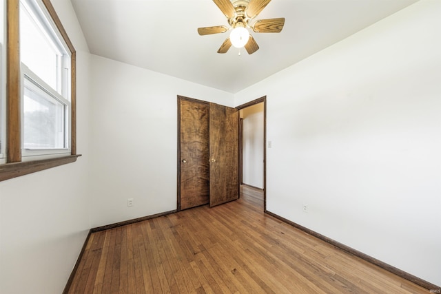 1209 E Water St, Mount Vernon, IN 47620 - unfurnished bedroom with light wood-type flooring, baseboards, a closet, and ceiling fan