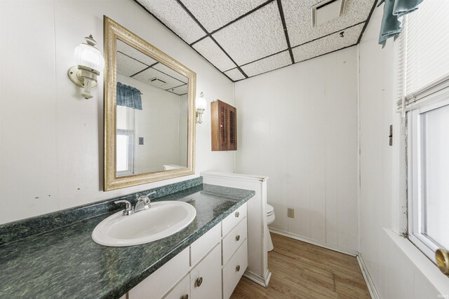 1209 E Water St, Mount Vernon, IN 47620 - half bath with toilet, vanity, wood finished floors, a drop ceiling, and baseboards