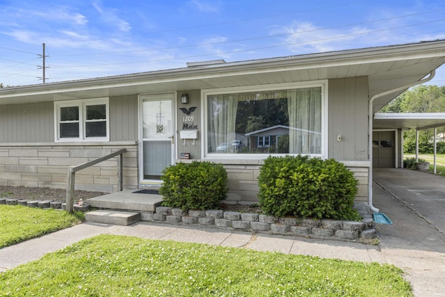 1209 E Water St, Mount Vernon, IN 47620 - view of front facade featuring a carport and concrete driveway