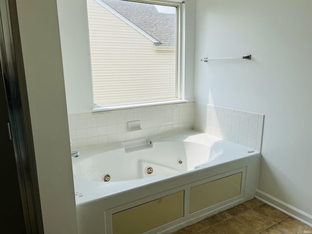9987 Rainbow Falls Ln, Fishers, IN 46037 - full bath featuring a whirlpool tub, plenty of natural light, and baseboards