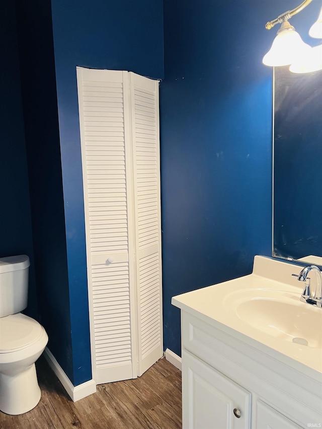 9987 Rainbow Falls Ln, Fishers, IN 46037 - bathroom with a closet, toilet, vanity, and wood finished floors
