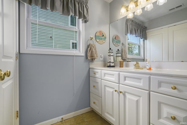 8056 E N Rd, Syracuse, IN 46567 - bathroom featuring vanity, baseboards, and tile patterned flooring