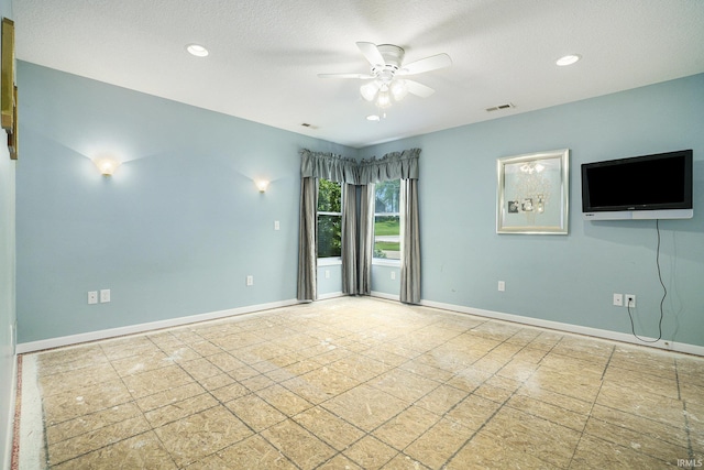 8056 E N Rd, Syracuse, IN 46567 - tiled spare room with a ceiling fan, baseboards, recessed lighting, and a textured ceiling
