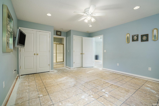 8056 E N Rd, Syracuse, IN 46567 - unfurnished bedroom with baseboards, recessed lighting, two closets, and a ceiling fan
