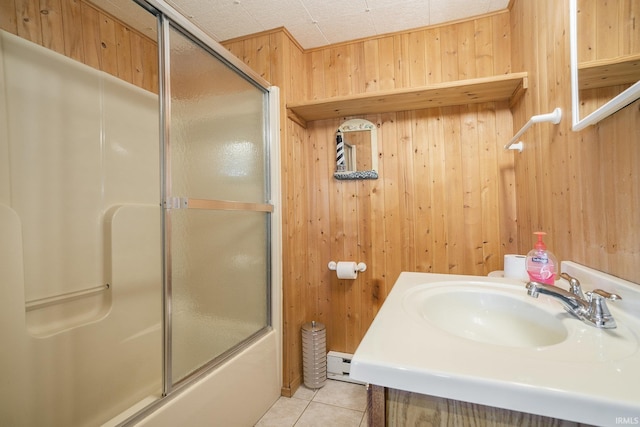 8056 E N Rd, Syracuse, IN 46567 - bathroom featuring wooden walls, baseboard heating, bath / shower combo with glass door, tile patterned floors, and vanity