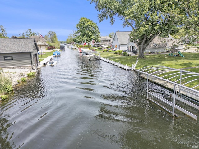 8056 E N Rd, Syracuse, IN 46567 - dock area featuring a water view, a playground, a lawn, and a residential view