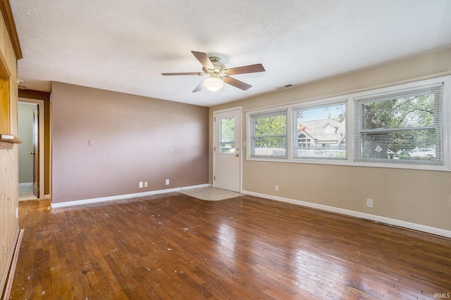 8056 E N Rd, Syracuse, IN 46567 - unfurnished room with a ceiling fan, wood-type flooring, and baseboards