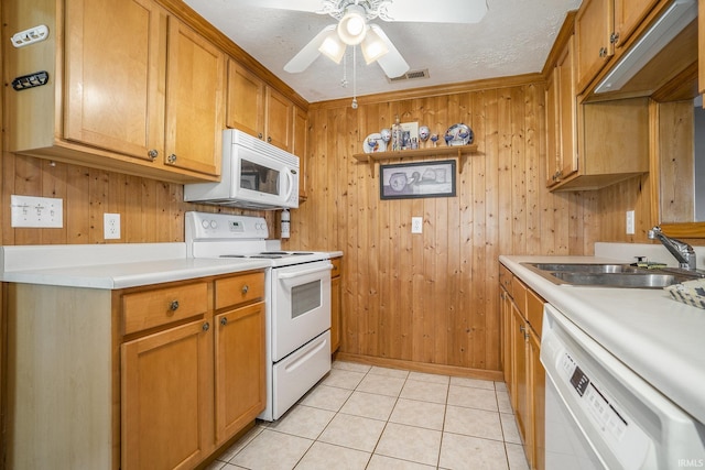 8056 E N Rd, Syracuse, IN 46567 - kitchen with white appliances, a sink, light countertops, wood walls, and ceiling fan