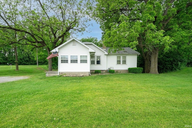 59479 Mayflower Rd, South Bend, IN 46619 - rear view of house featuring a lawn