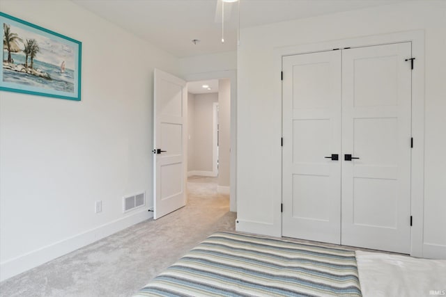 316 S Saint Peter St Unit 7, South Bend, IN 46617 - unfurnished bedroom with light carpet, a closet, and baseboards