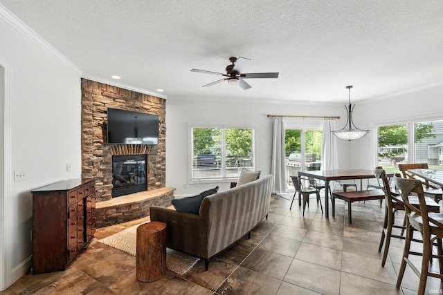 16265 Gemma Pass, Huntertown, IN 46748 - living area featuring ornamental molding, a stone fireplace, ceiling fan, a textured ceiling, and recessed lighting