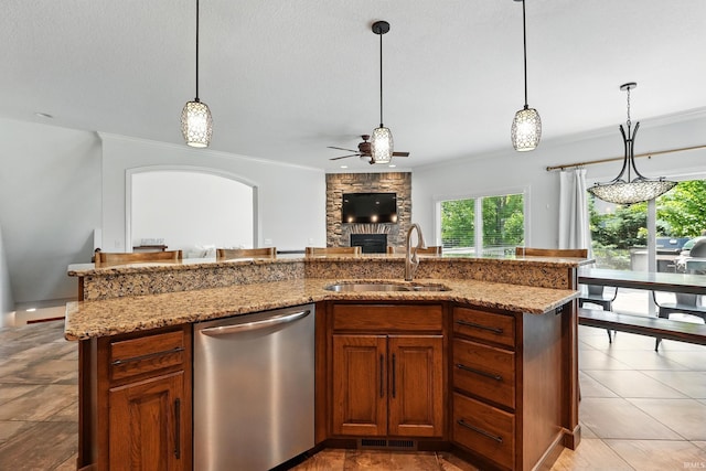 16265 Gemma Pass, Huntertown, IN 46748 - kitchen with stainless steel dishwasher, a sink, a fireplace, ceiling fan, and crown molding