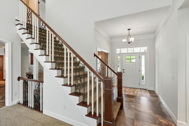 16265 Gemma Pass, Huntertown, IN 46748 - entrance foyer with baseboards, a chandelier, and stairs