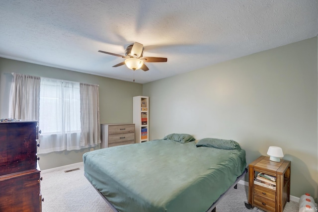 3502 S Tyler Ln, Bloomington, IN 47403 - bedroom featuring carpet flooring, baseboards, ceiling fan, and a textured ceiling