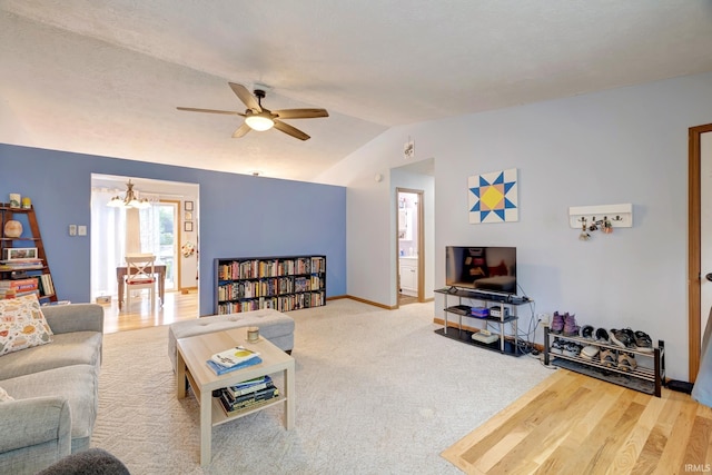3502 S Tyler Ln, Bloomington, IN 47403 - living room with lofted ceiling, a chandelier, a ceiling fan, and baseboards